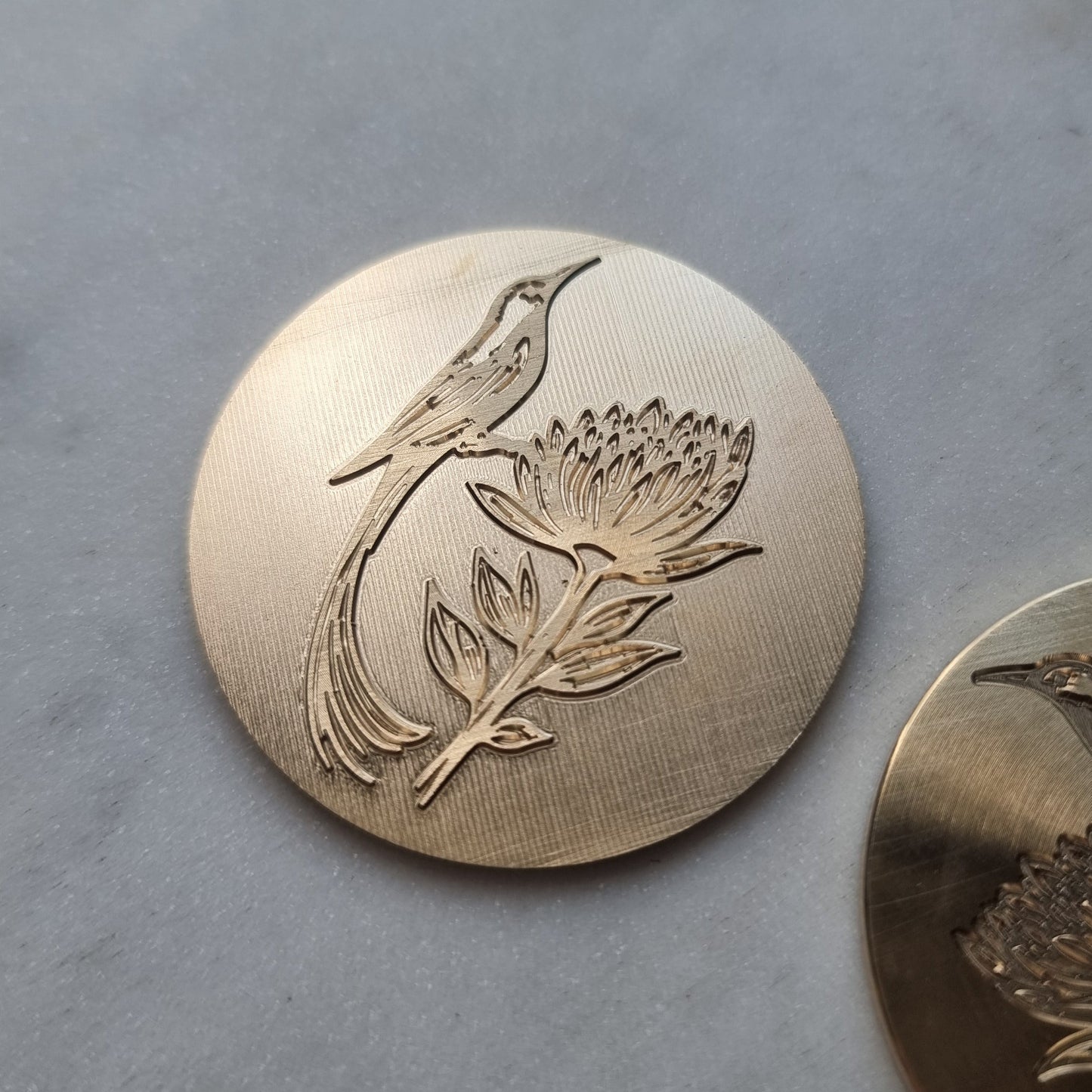 Engraved bird in brass for a custom embossing stamp