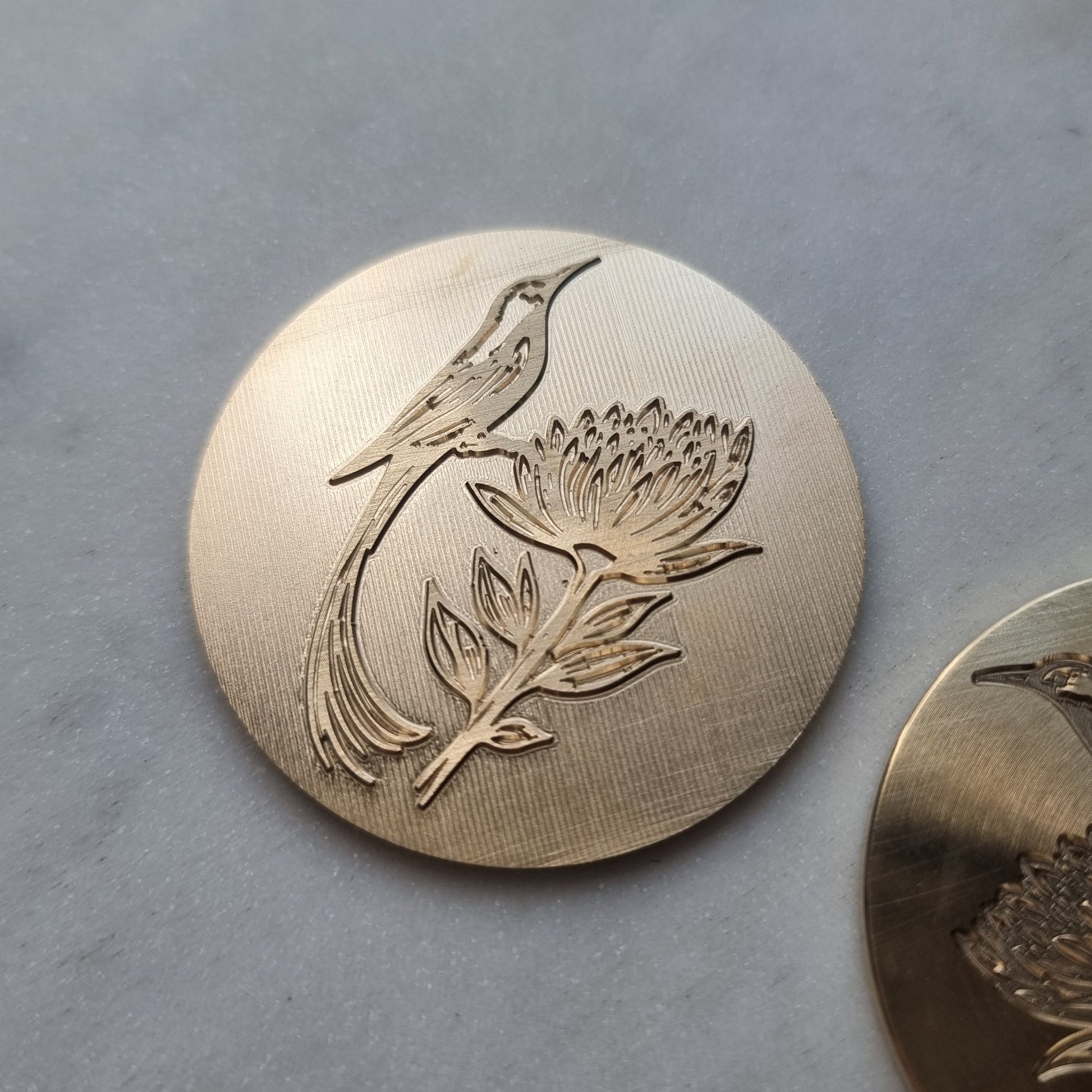 Engraved bird in brass for a custom embossing stamp